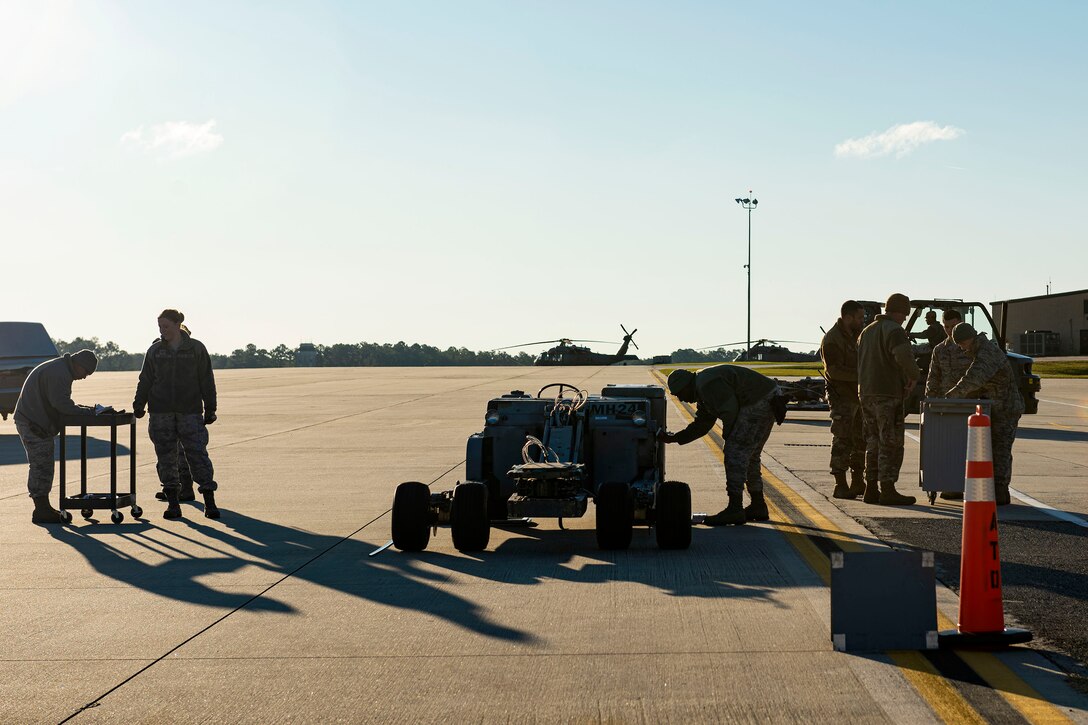 Airmen assigned to the 23d Logistics Readiness Squadron (LRS) transport resources through a cargo deployment function during exercise FT 20-01 Nov. 13, 2019, at Moody Air Force Base, Ga. FT 20-01 is a force generation exercise designed to validate the 23d Wing's ability to deploy the 75th Fighter Squadron in support of contingency operations. The 23d LRS conducted a staging area for cargo and equipment where they ensured all resources were properly weighed prior to being loaded onto a simulated aircraft. (U.S. Air Force photo by Senior Airman Erick Requadt)