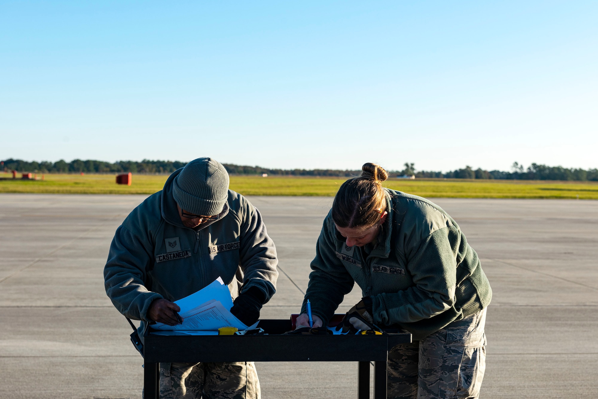 A photo of Airmen checking equipment and cargo during an exercise