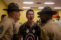 A new recruit with Fox Company, 2nd Recruit Training Battalion, responds to drill instructors during receiving at Marine Corps Recruit Depot San Diego, Nov. 4, 2019.