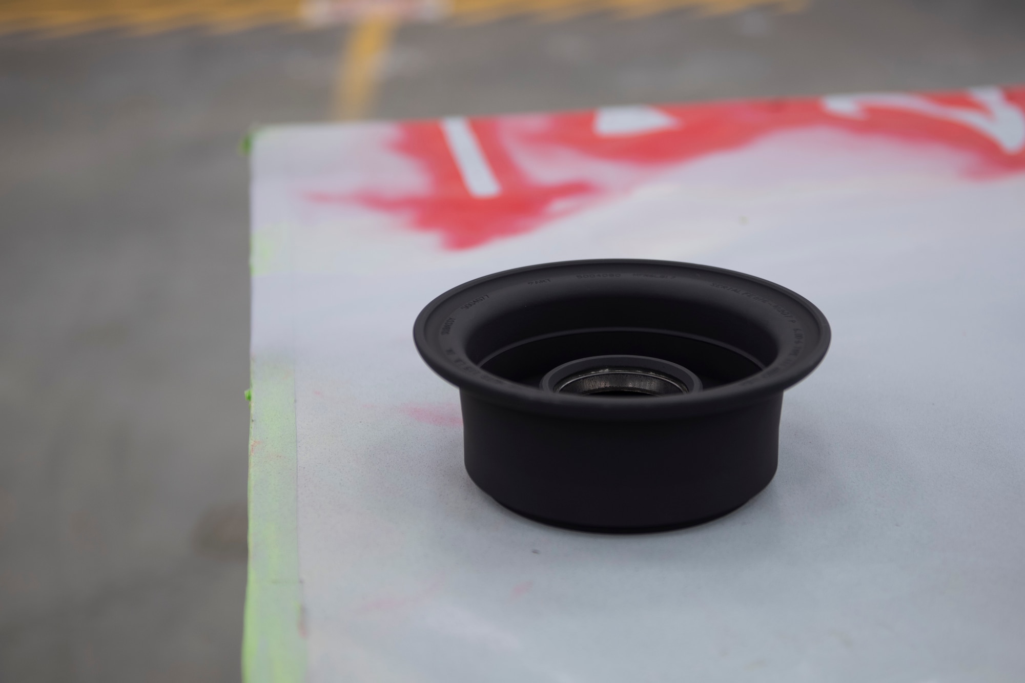 A photo of a helicopter tail wheel drying on a table