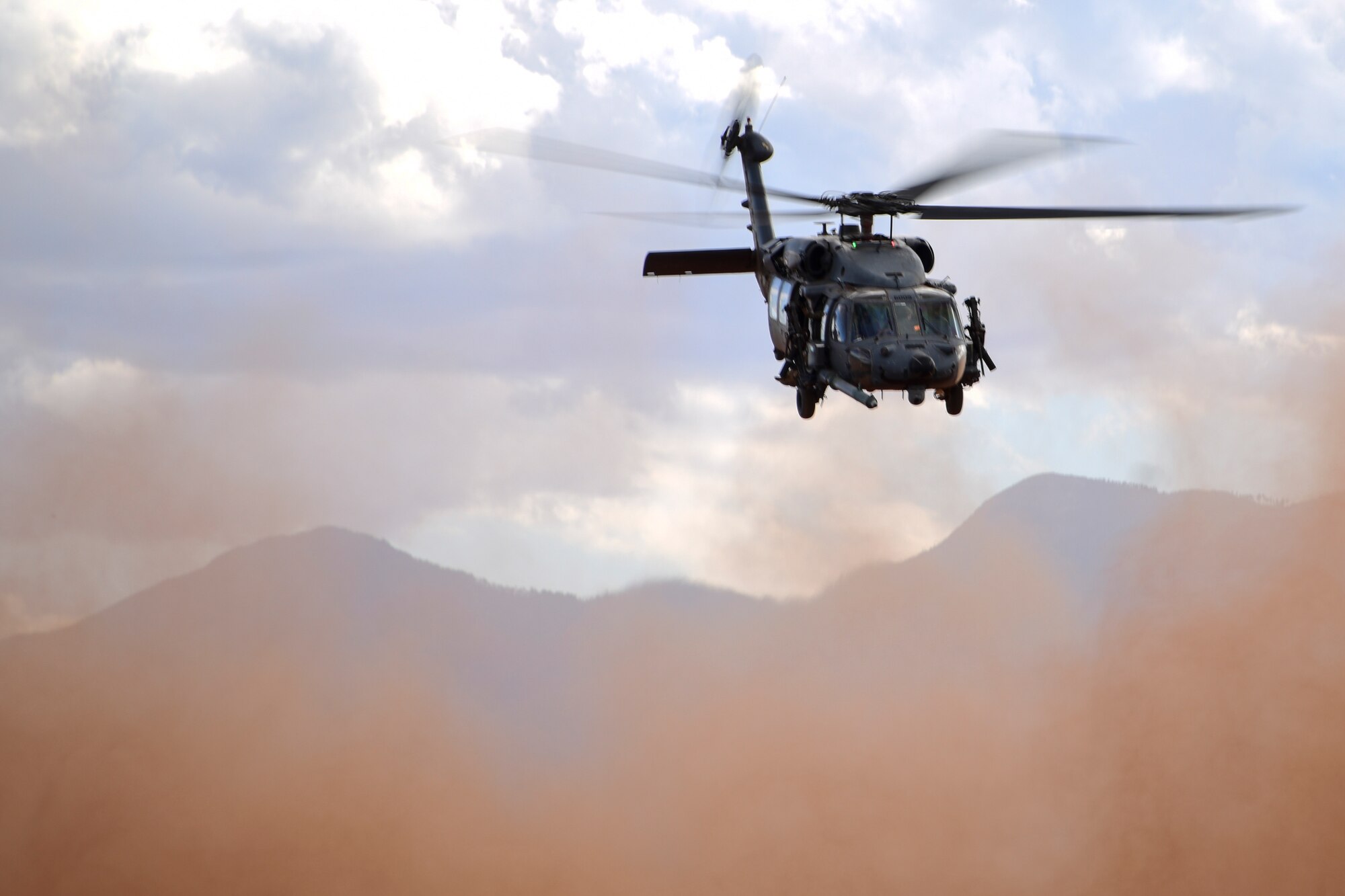 A photo of an HH-60 flying.
