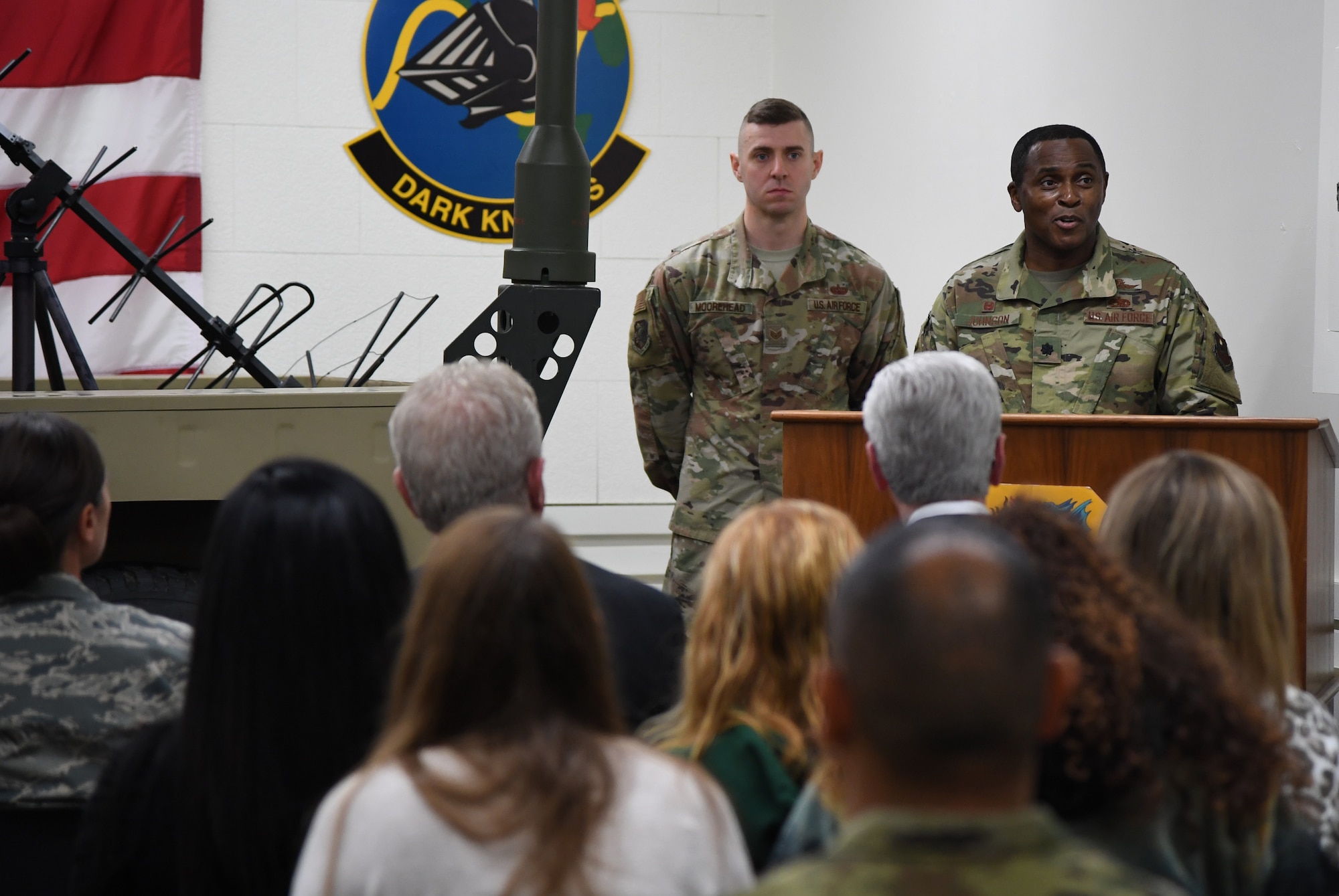 U.S. Air Force Lt. Col. Andre Johnson, 338th Training Squadron commander, delivers remarks during the radio frequency transmission systems course graduation inside Jones Hall at Keesler Air Force Base, Mississippi, Nov. 8, 2019. Phil Bryant, Governor of Mississippi, presented certificates to the nine course graduates during the ceremony. (U.S. Air Force photo by Kemberly Groue)