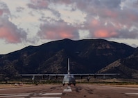 A photo of a Marine Corps KC-130J sitting on a flightline.
