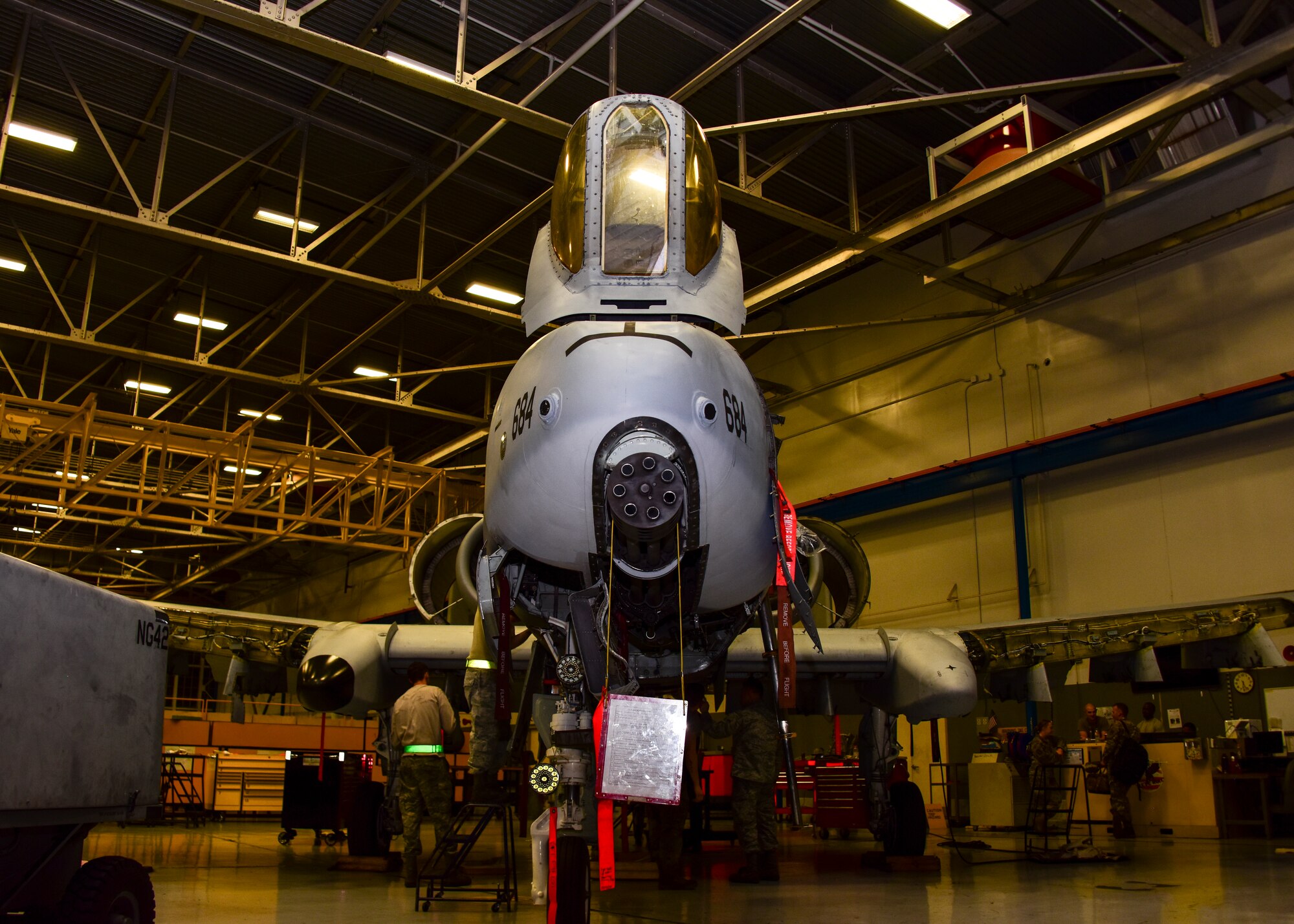 A photo of an A-10 sitting in a hangar.