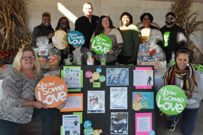 IMAGE: DAHLGREN, Va. (Nov. 6, 2019) – Pictured at the Combined Federal Campaign (CFC) Charity Fair sponsored by Naval Surface Warfare Center Dahlgren Division (NSWCDD), left to right: Gloria Evans, Liz Comacho-Hart, NSWCDD Commanding Officer Capt. Casey Plew, Rebecca Stork, Shermanda Williams, Christine Tolbert, and Gilbert Correa-Ruiz. Second row, left to right: Katy Evans and Lisa Wallington. “I observed several of NSWC Dahlgren employees engaged in conversation with the participating charities,” said Wallington, the Naval Sea Systems Command CFC co-campaign manager. “I’m certain that those conversations are going to impact the surrounding communities in a positive and lasting way.”  (U.S. Navy photo/Released)