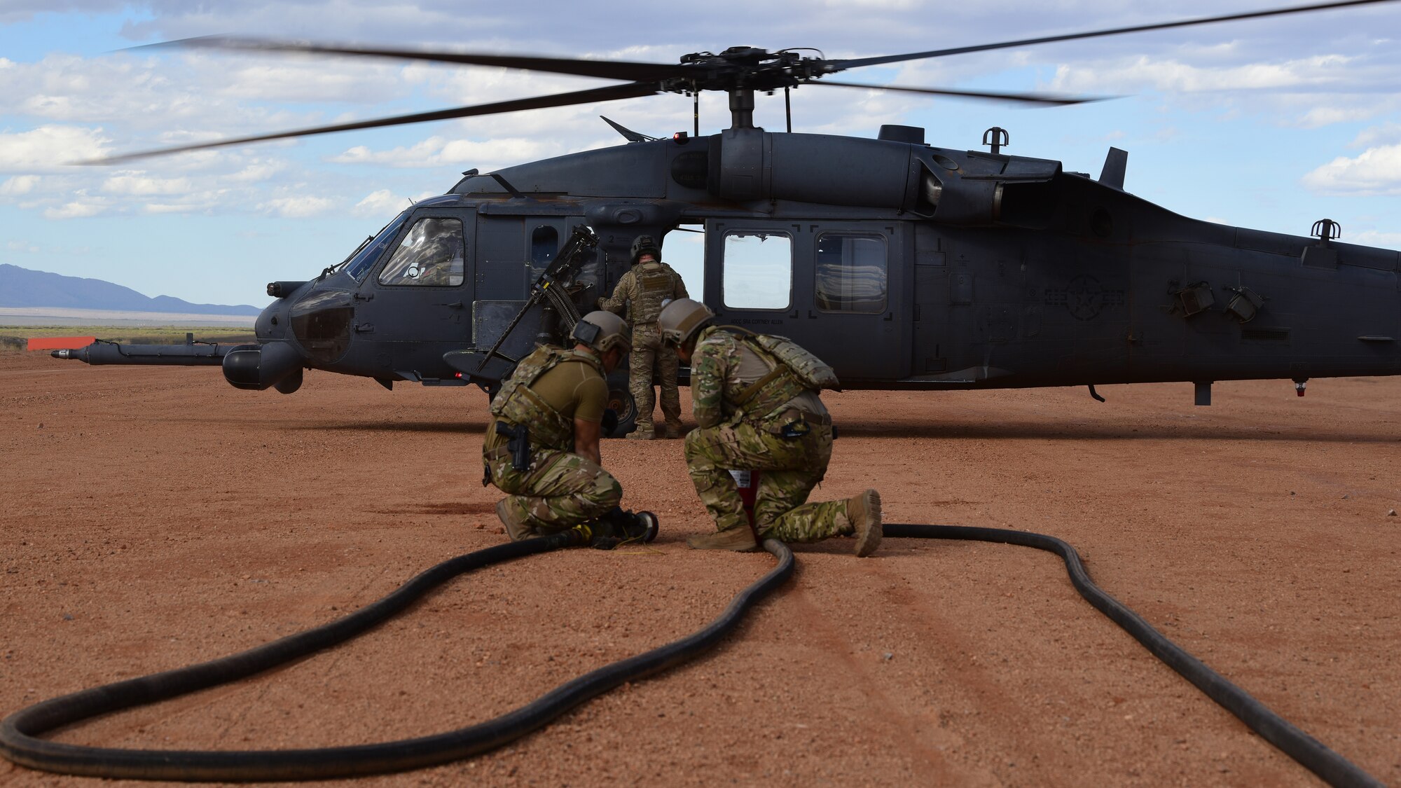 a photo of airmen performing forward area refueling operations