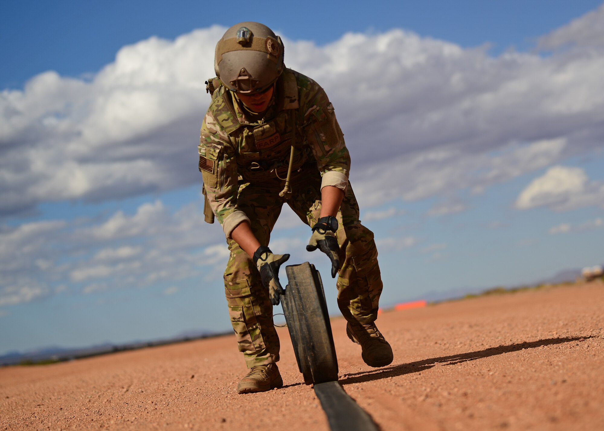 a photo of an airman performing forward area refueling operations