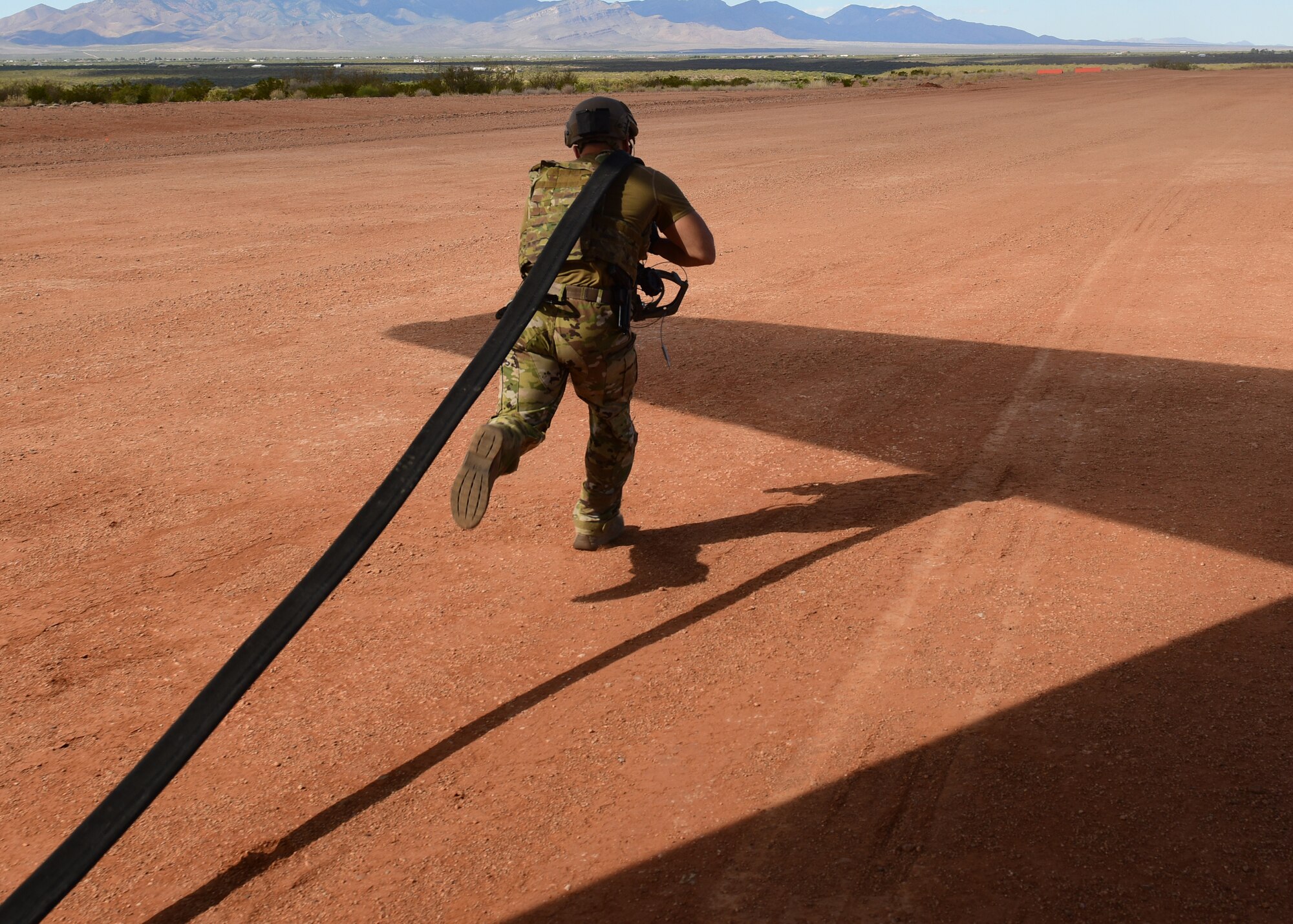 a photo of an airman performing forward area refueling operations