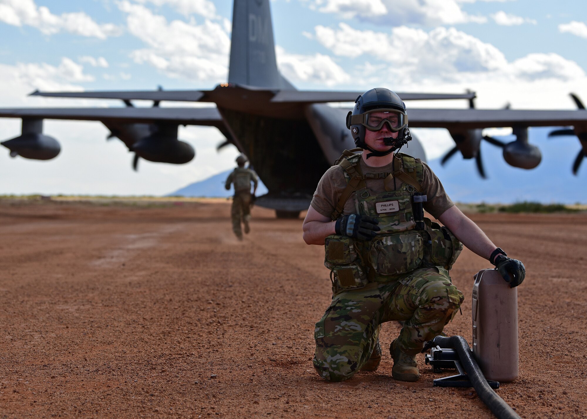a photo of an airman performing forward area refueling operations