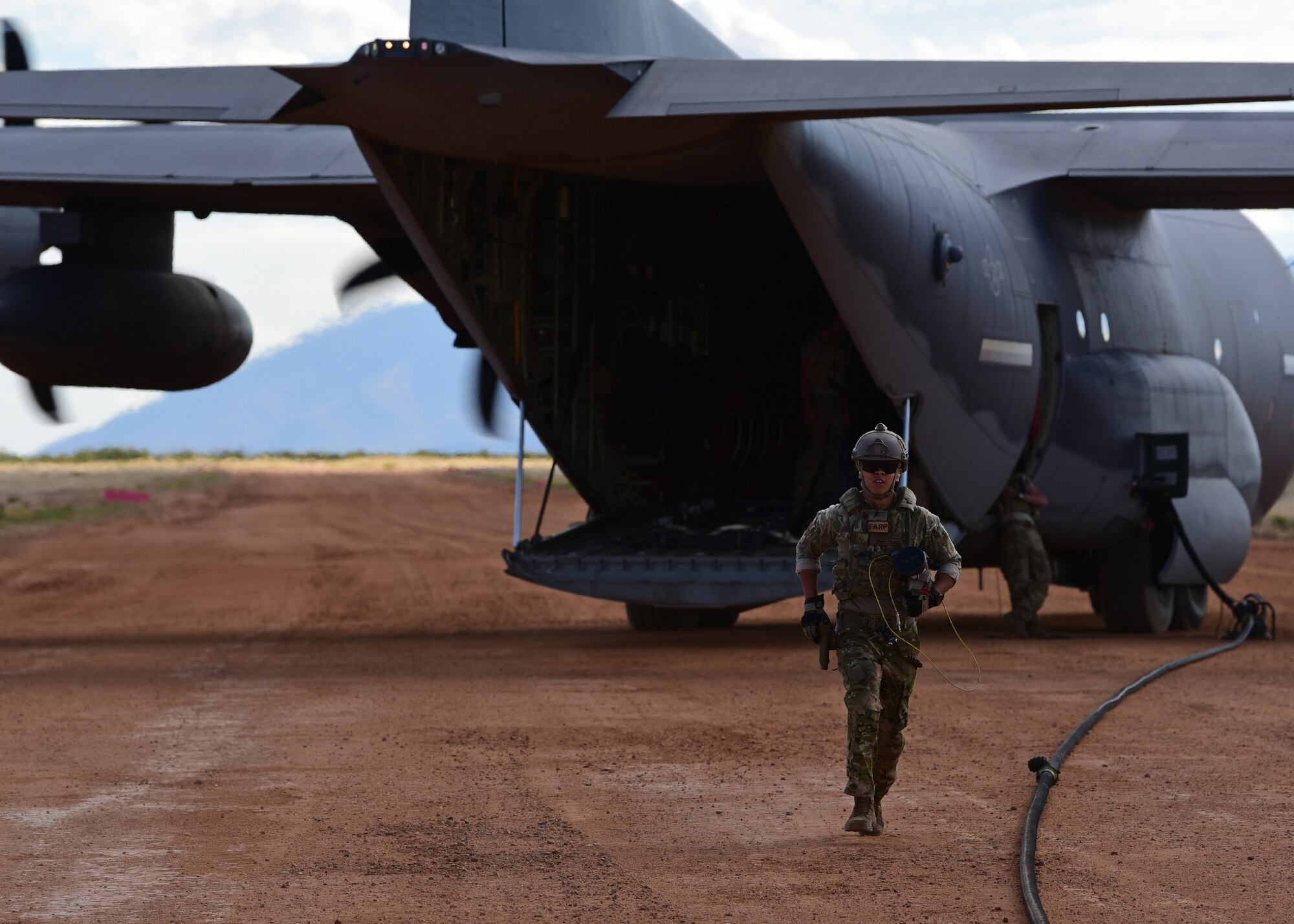 A photo of an airman performing FARP operations during an exercise.