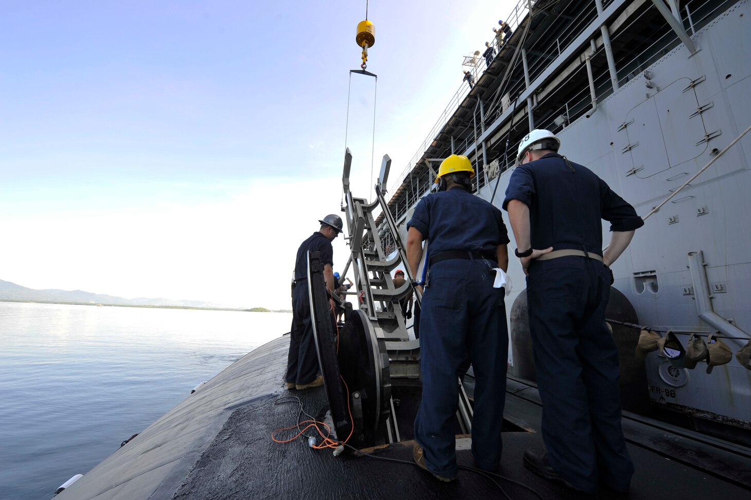 PUERTO PRINCESA, Philippines (Nov. 11, 2019) - Sailors assigned to the submarine tender USS Emory S. Land (AS 39) and Los Angeles-class attack submarine USS Asheville (SSN 758) participate in a weapons handling training evolution, Nov. 11. Land is deployed to the U.S. 7th Fleet area of operations to support theater security cooperation efforts in the Indo-Pacific region.