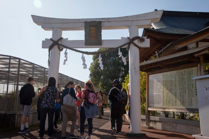 Marine Corps Air Station Iwakuni residents and Iwakuni locals learn about the symbolic Iwakuni white snake during a Cultural Adaptation Program trip to the Iwakuni Shirohebi Shrine in Iwakuni, Japan, Nov. 1, 2019. The visit to the shrine gave station residents the opportunity to learn the history of, and interact with, the white snake species.(U.S. Marine Corps photo by Cpl. Angelo Sagum)