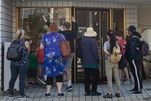 Marine Corps Air Station Iwakuni residents and Iwakuni locals visit a local bakery during a Cultural Adaptation Program trip to the Iwakuni Shirohebi Shrine in Iwakuni, Japan, Nov. 1, 2019. The visit to the shrine gave station residents the opportunity to learn the history of, and interact with, the white snake species.(U.S. Marine Corps photo by Cpl. Angelo Sagum)