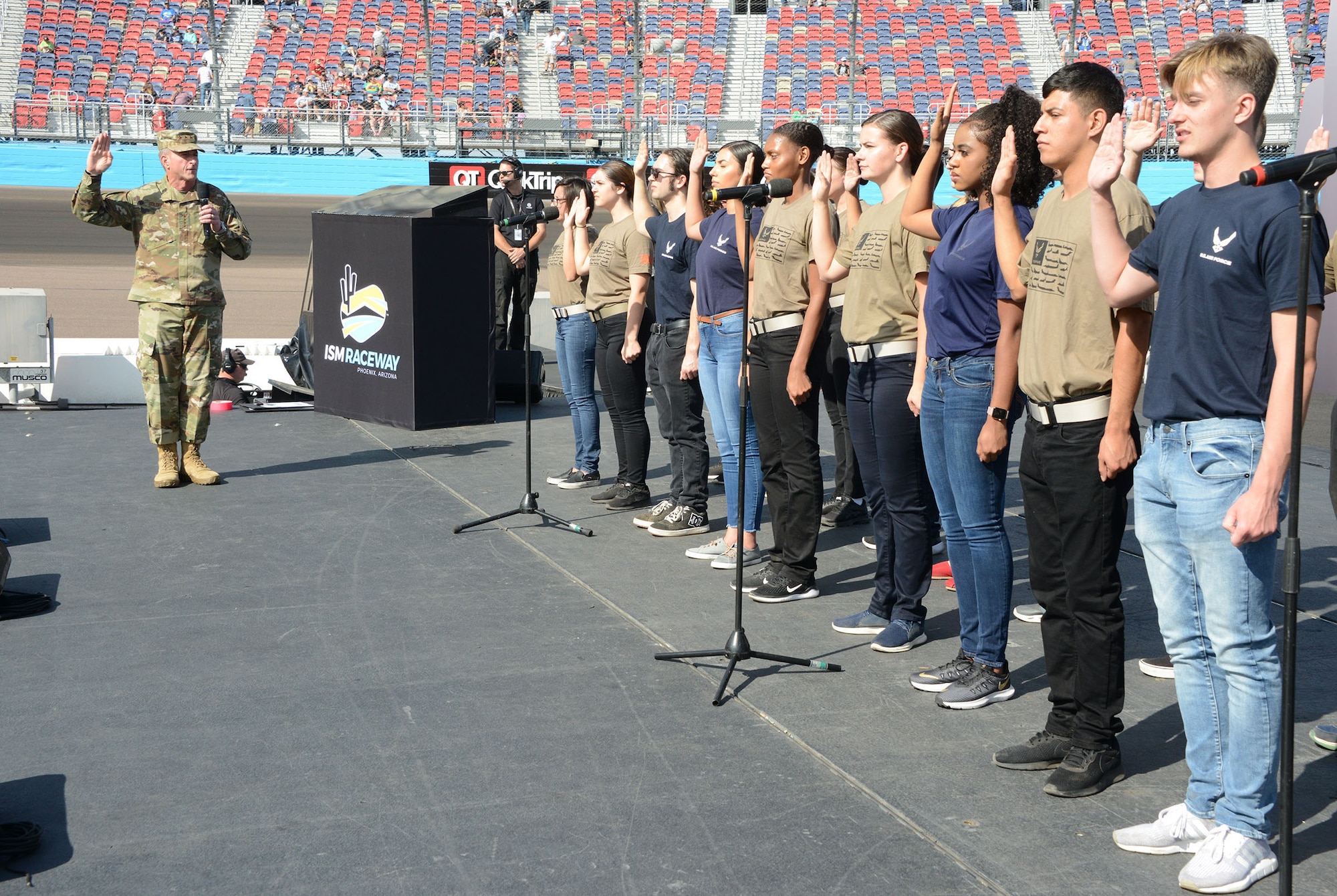 Gen. David L. Goldfein, Air Force chief of staff, conducts a total force enlistment prior to the NASCAR race Sunday in Phoenix