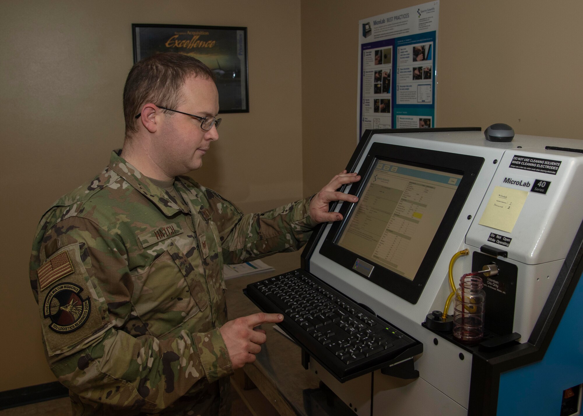 U.S. Air Force Staff Sgt. Kurt Hatch, 92nd Logistics Readiness Squadron assistant noncommissioned officer in charge, evaluates the results of transmission fluid analyzed by the Micro Lab 40 Series at Fairchild Air Force Base, Washington, Nov. 4, 2019. The oil analysis takes about five minutes per sample and provides data that technicians use to see if the oil needs to be changed or if there are indicators of future damage or component failure. (U.S. Air Force photo by Airman Anneliese Kaiser)