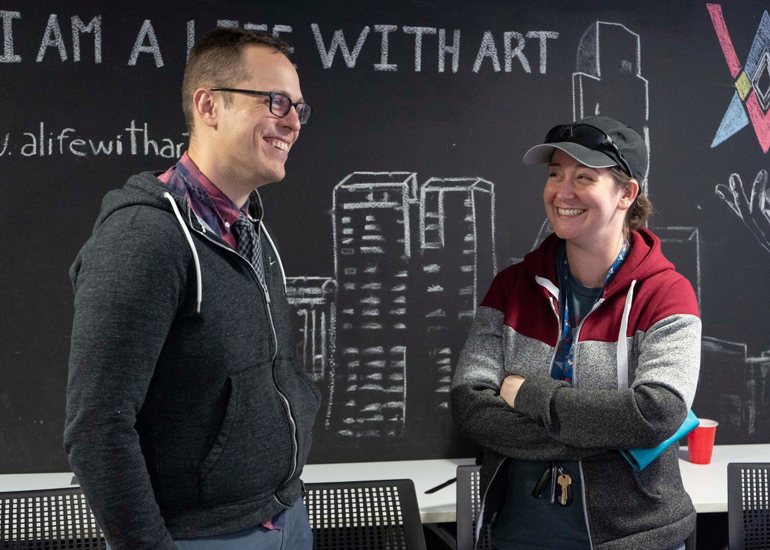 Maj. Adam Messer, left, Air Force Operations Research Analyst career field assignments officer, and Maj. Rachel Ramirez, right, Project NEXUS student, talk following the course’s final mentorship event at the AFWERX-Austin hub, Oct. 16, 2019. Members of the U.S. Air Force’s solution center teams from LevelUP, KesselRun, Space CAMP, and Shadow OC visited the students for a panel discussion on topics like talent management and developing digital competencies within the Air Force. (Air National Guard Photo by Staff Sgt. Jordyn Fetter)