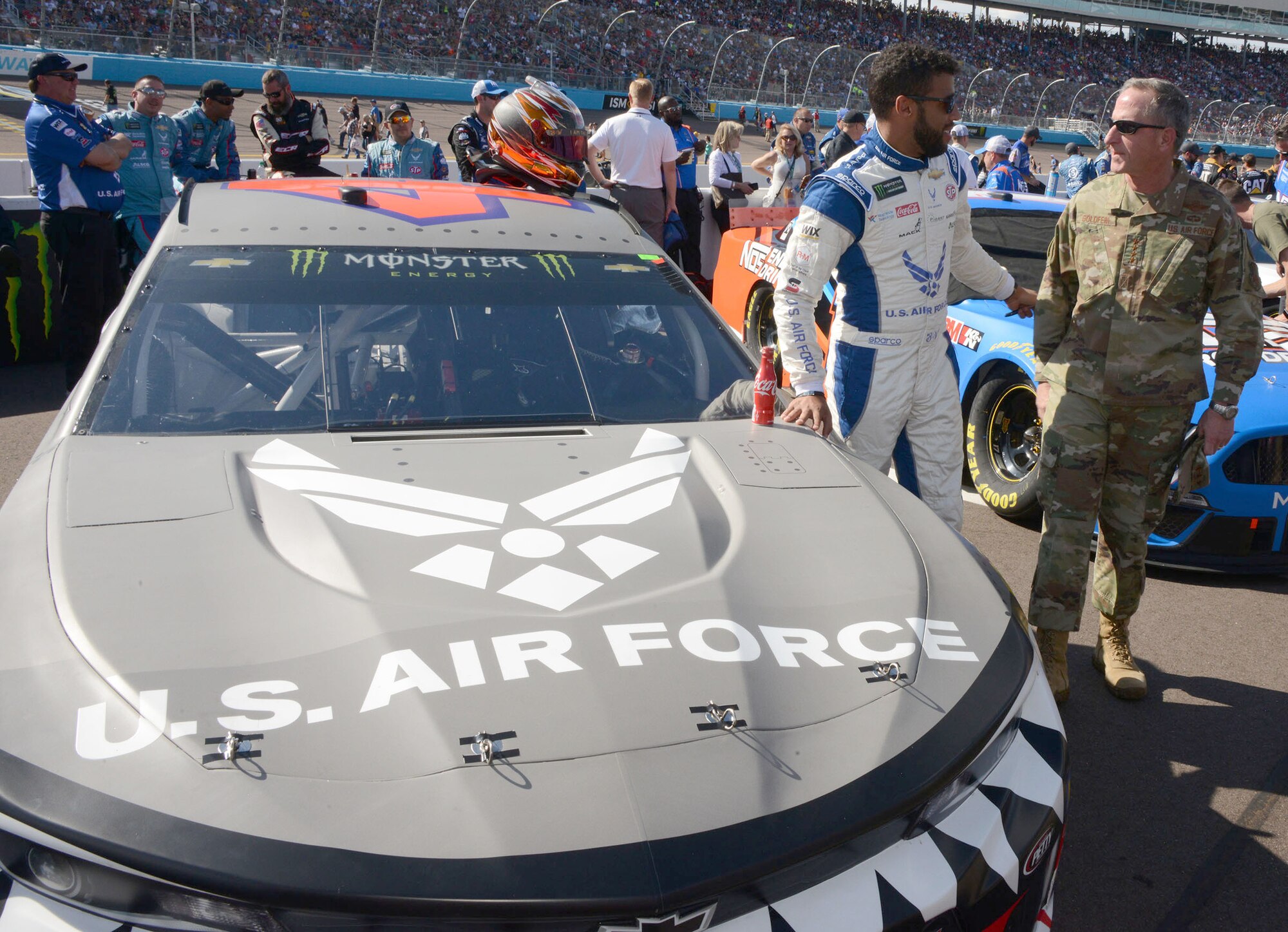 Bubba Wallace, the driver of the Air Force car, talks to Gen. David L. Goldfein, Air Force chief of staff, moments before the start of the Bluegreen Vacations 500 NASCAR race in Phoenix