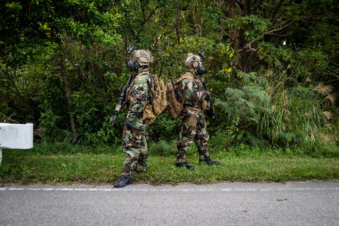 Marines with the 31st Marine Expeditionary Unit's Maritime Raid Force provide security during a no-notice flyaway Chemical, Biological, Radiological, Nuclear response exercise on Camp Hansen, Okinawa, Japan, Oct. 31, 2019.