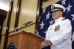 Cmdr. Christopher Carreon addresses the audience during change of command ceremony for HSC-25.