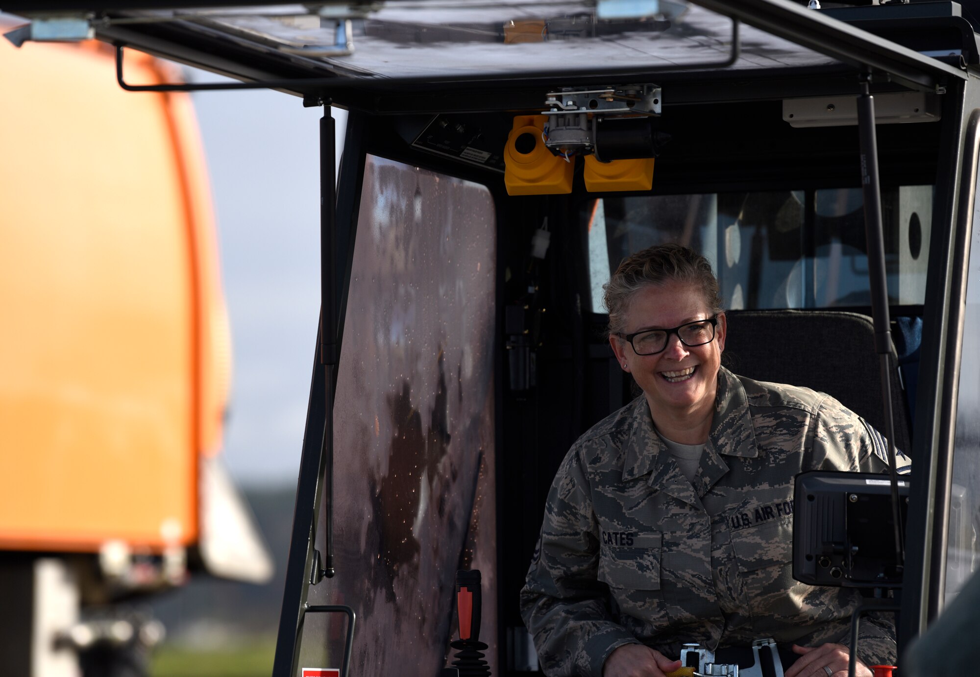 U.S. Air Force Chief Master Sgt. Stephanie Cates, 52nd Fighter Wing command chief, prepares to operate an aircraft deicer during a snow and ice parade at Spangdahlem Air Base, Germany, Nov. 8, 2019. The parade allowed the 52nd Civil Engineer Squadron to show leadership winter equipment which keeps the runway open and ensures the mission continues without interruption. (U.S. Air Force photo by Staff Sgt. Preston Cherry)