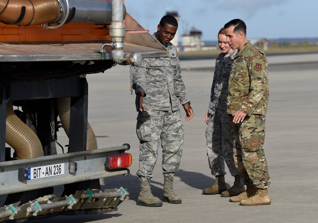 U.S. Air Force Senior Airman Kevin Mouzon and Airman 1st Class Faythlynn Cruse, 52nd Civil Engineer Squadron water and fuel system maintenance technicians, center, explain the purpose of winter equipment to Col. Jason Hokaj, 52nd Fighter Wing vice commander, right, during the snow and ice parade at Spangdahlem Air Base, Germany, Nov. 8, 2019. The parade showed leadership how the base runway is cleared and kept safe during winter weather. (U.S. Air Force photo by Staff Sgt. Preston Cherry)