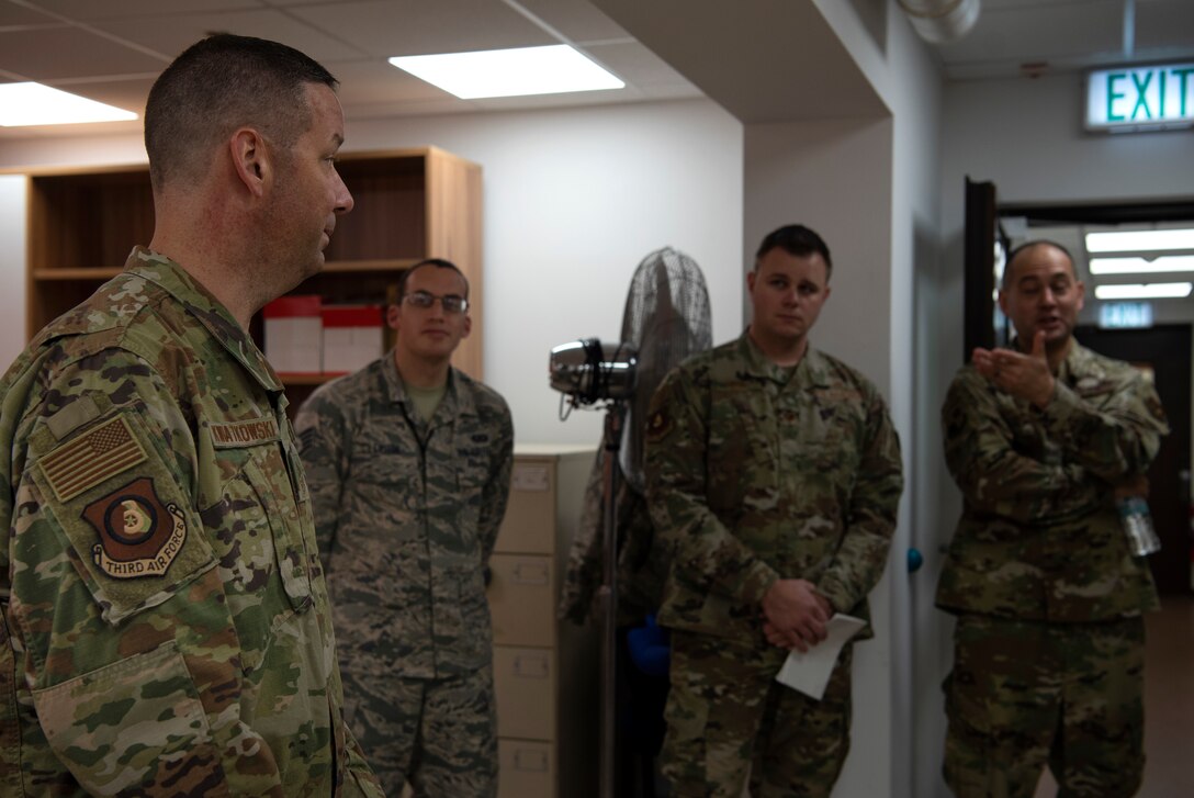 U.S. Air Force Chief Master Sgt. Randy Kwiatkowski, Third Air Force command chief, left, speaks with Airmen in the command post at Spangdahlem Air Base, Germany, Nov. 13, 2019. Kwiatkowski visited various locations around Spangdahlem AB to get to know Airmen. Members of the command post spoke with Kwiatkowski about the struggles and successes of maintaining 24-hour operations. (U.S. Air Force photo by Airman 1st Class Valerie Seelye)