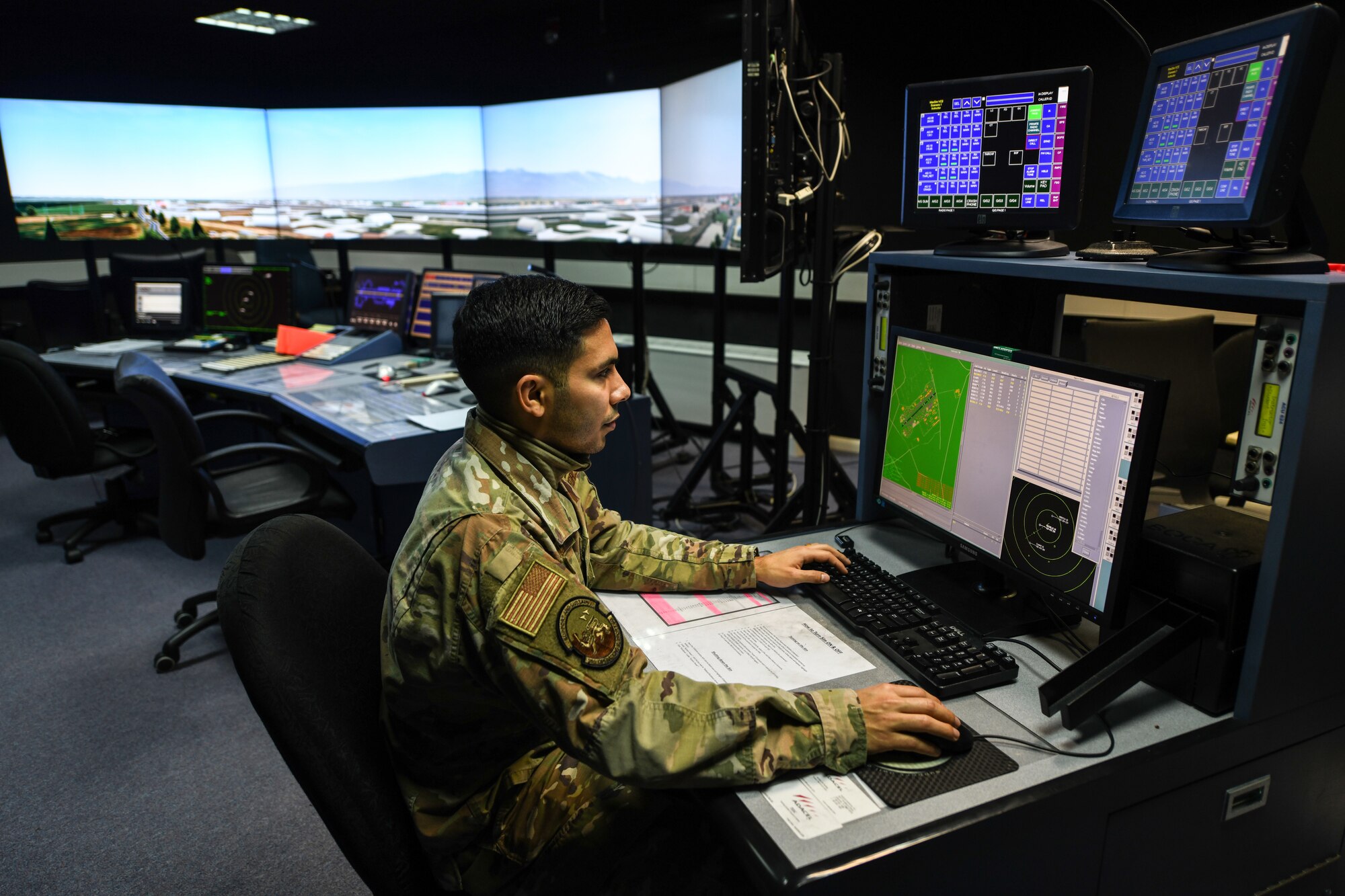 U.S. Air Force Staff Sgt. Daniel Cabezas, an air traffic control watch supervisor from the 31st Operations Support Squadron, pilots a tower simulator system at Aviano Air Base, Italy, Nov. 13, 2019. The TSS trains air traffic controllers for proficiency in upgrade training and helps our host nation with their certifications. (U.S. Air Force photo by Airman 1st Class Ericka A. Woolever).