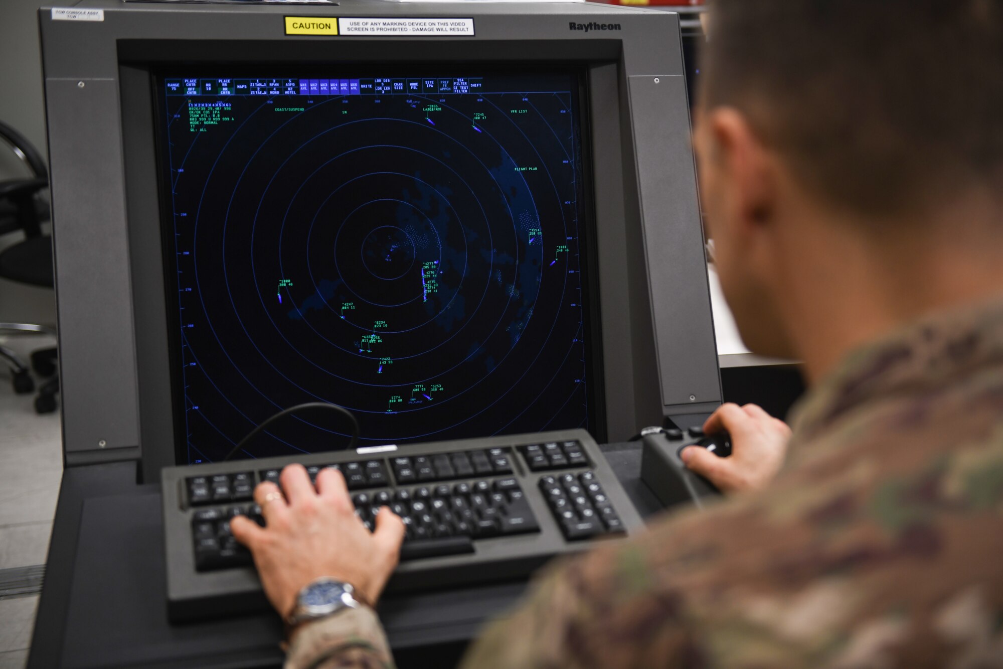 U.S. Air Force Senior Airmen Kyle Burns, a radar airfield weather systems technician from the 31st Operations Support Squadron, looks at processed data from the Digital Airport Surveillance Radar at Aviano Air Base, Italy, Nov. 13, 2019. The DASR provides real time location, altitude and range for all aircraft within a 60 mile radius. (U.S. Air Force photo by Airman 1st Class Ericka A. Woolever).
