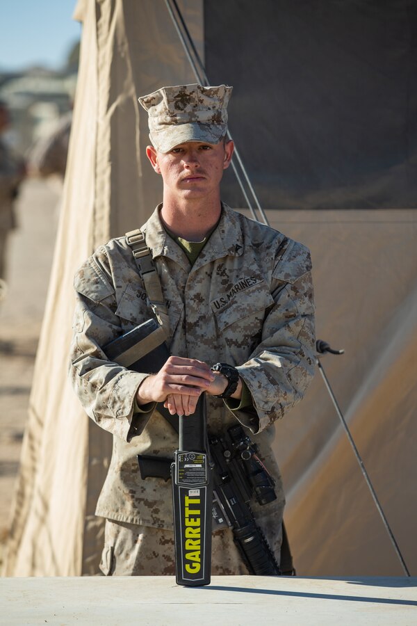 U.S. Marine Corps Lance Cpl. Payton Johnson, a percussion instrumentalist with Headquarters Battalion, 2nd Marine Division (2d MARDIV), poses for a photograph at Camp Wilson, Marine Corps Air Ground Combat Center, Twentynine Palms, California, Nov. 10, 2019. Johnson has been in the Marine Corps for a year. He said he enjoys the Marine Corps because, “The Marine Corps has given me a different outlook on life, I’ve learned how to appreciate people like my friends and family.” Johnson said the Marine Corps was an opportunity to travel the world. Johnson and the band participated in MAGTF Warfighting Exercise (MWX) 1-20 as a security force. MWX was the largest exercise conducted by 2d MARDIV in several decades. (U.S. Marine Corps photo by Lance Cpl. Jesse Carter-Powell)