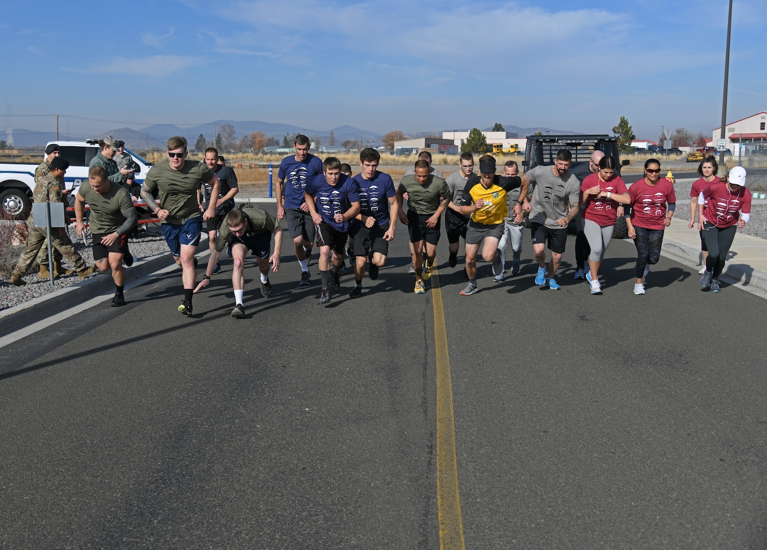 Agencies from around the Klamath Basin start the run portion of a Blue Zones Klamath Falls initiative to promote male health awareness for the month of November at Kingsley Field in Klamath Falls, Ore. Nov. 6, 2019. Klamath Falls Fire District #1, Oregon Department of Forestry, Klamath Falls Police Department. and the 173rd Fighter Wing fielded teams in the initiative.