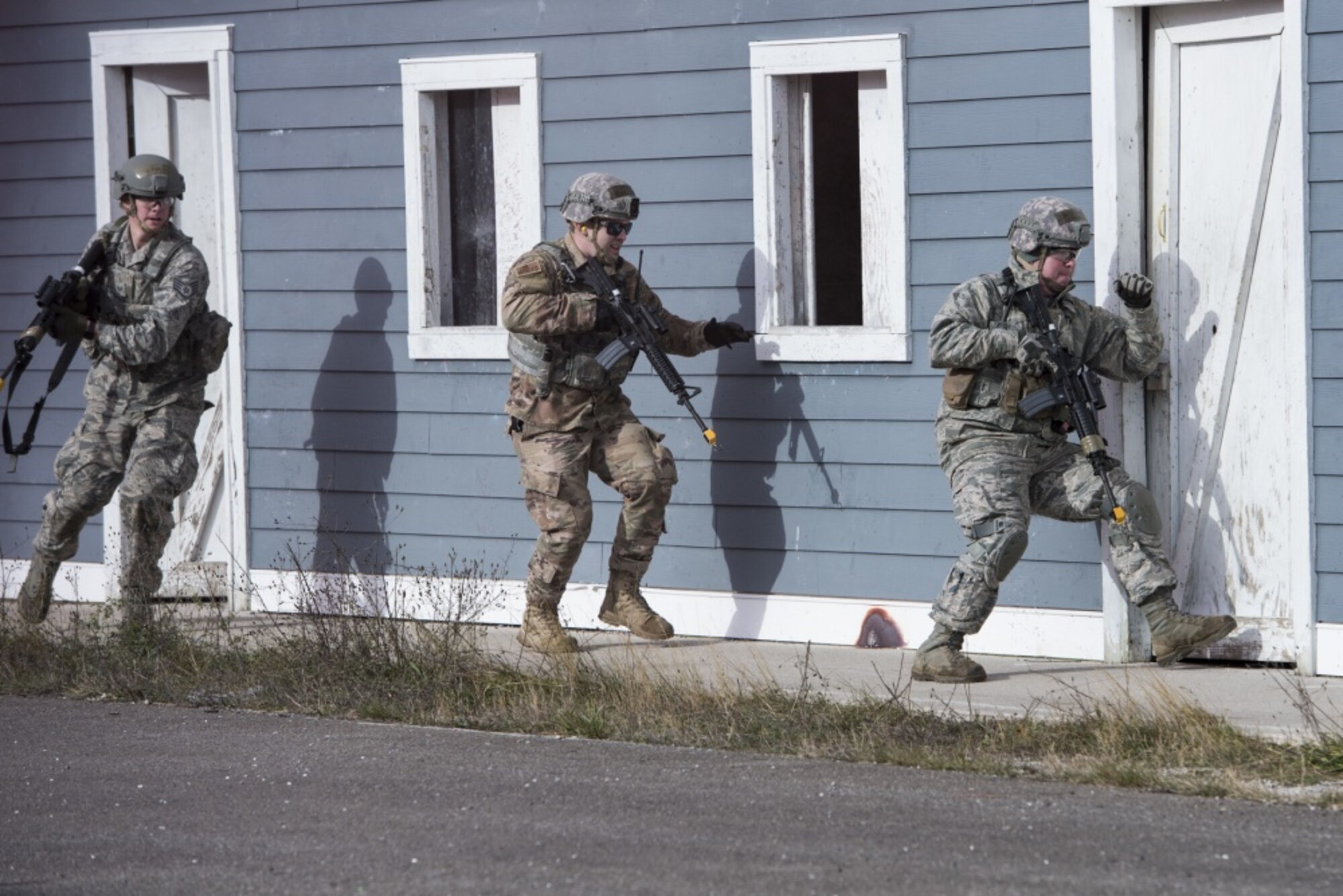 U.S. Air Force Airmen, assigned to the Security Forces Squadron at the 167th Airlift Wing, West Virginia Air National Guard, practice clearing buildings during a full-scale readiness exercise in Alpena, Mich., Nov. 4 2019. Approximately 300 members assigned to the 167th deployed to the Combat Readiness Training Center Nov. 3-7. (U.S. Air National Guard photo by Senior Master Sgt. Emily Beightol-Deyerle)