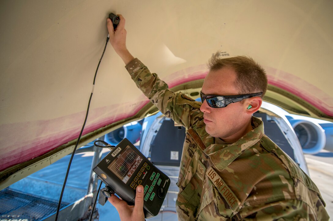 Tech. Sgt. Timothy Schwenning, 437th Maintenance Squadron, Fabrication Flight Non Destructive Inspection NCO in charge, checks the disbonds and delamination on the Nose Radome on a C-17 Nov.1, 2019, at Joint Base Charleston, S.C. During the bond test, the inner and outer radome is inspected to ensure the adhesive bonds two or more material components together.