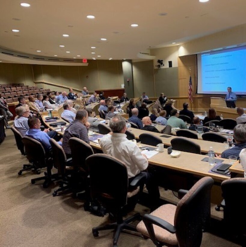 large group of individuals in an auditorium