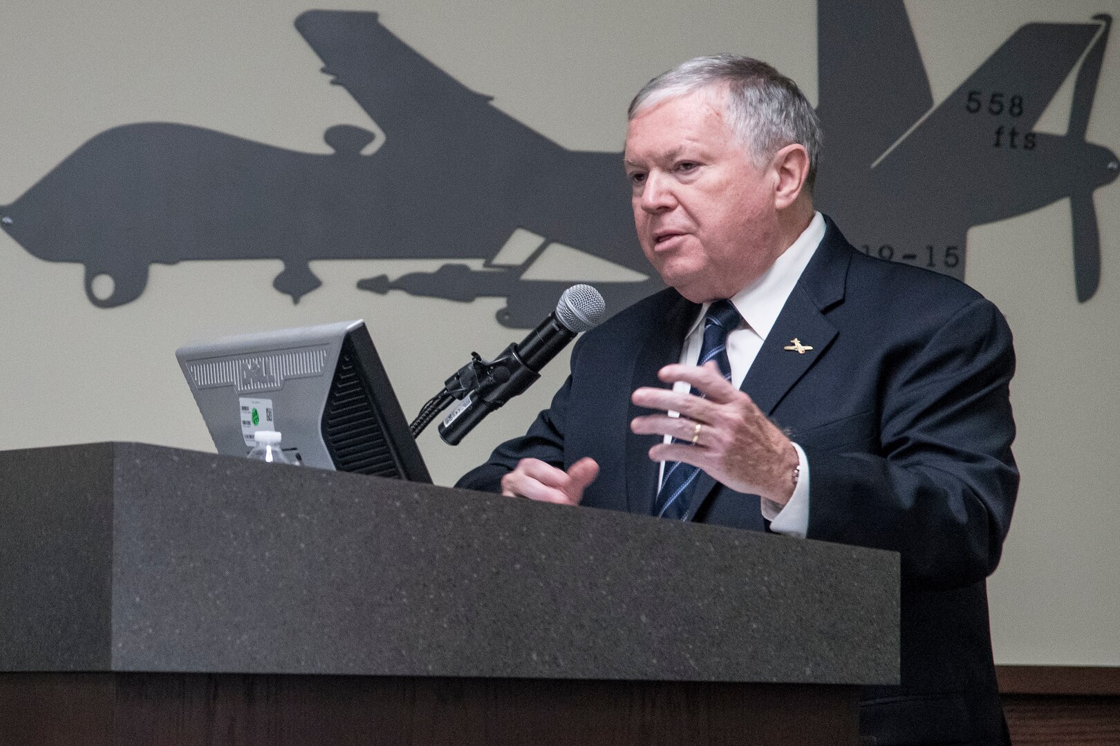 James Clark, family friend of the Crawford family, speaks during the 558th Flying Training Squadron’s Oliver “Ollie” Crawford Hall building dedication ceremony Nov. 13, 2019, at Joint Base San Antonio-Randolph, Texas. Crawford was a pilot, charter member of the Air Force Association and was instrumental in the formation of the Air Force Memorial in Washington, D.C. Crawford Hall is home to the 558th FTS, which is the sole source for all U.S. Air Force and U.S. Marine Corps undergraduate remotely piloted aircraft pilot and sensor operator training. (U.S. Air Force photo by Sean M. Worrell)
