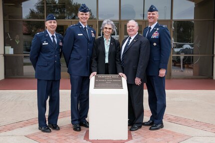 (From left to right) U.S. Air Force Lt. Col. Eric Bissonette, 558th Flying Training Squadron commander; Maj. Gen. Craig Wills, 19th Air Force commander; Nancy Crawford, wife of the late Oliver “Ollie” Crawford, James Clark, family friend of the Crawford family; and Col. Mark Robinson, 12th Flying Training Wing commander, stand in front of the dedication naming the 558th Flying Training Squadron building Crawford Hall. The dedication ceremony was held Nov. 13, 2019, at Joint Base San Antonio-Randolph, Texas, and is home to the sole source for all U.S. Air Force and U.S. Marine Corps undergraduate remotely piloted aircraft pilot and sensor operator training. Crawford was a pilot, charter member of the Air Force Association and was instrumental in the formation of the Air Force Memorial in Washington, D.C. (U.S. Air Force photo by Sean M. Worrell)