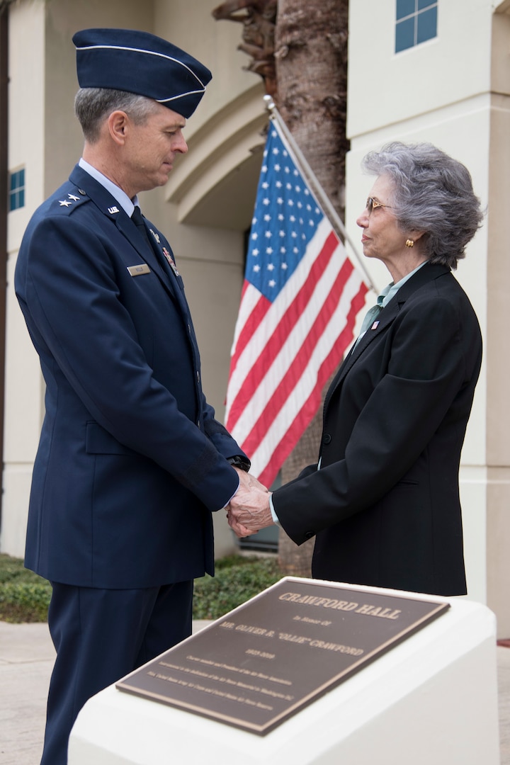 U.S. Air Force Maj. Gen. Craig Wills, 19th Air Force commander, speaks with Nancy Crawford after the Crawford Hall dedication ceremony Nov. 13, 2019, at Joint Base San Antonio-Randolph, Texas. Crawford was a pilot, charter member of the Air Force Association and was instrumental in the formation and dedication of the Air Force Memorial in Washington, D.C. The newly-dedicated building is home to the 558th Flying Training Squadron, which is the sole source for all U.S. Air Force and U.S. Marine Corps undergraduate remotely piloted aircraft pilot and sensor operator training.. (U.S. Air Force photo by Sean M. Worrell)