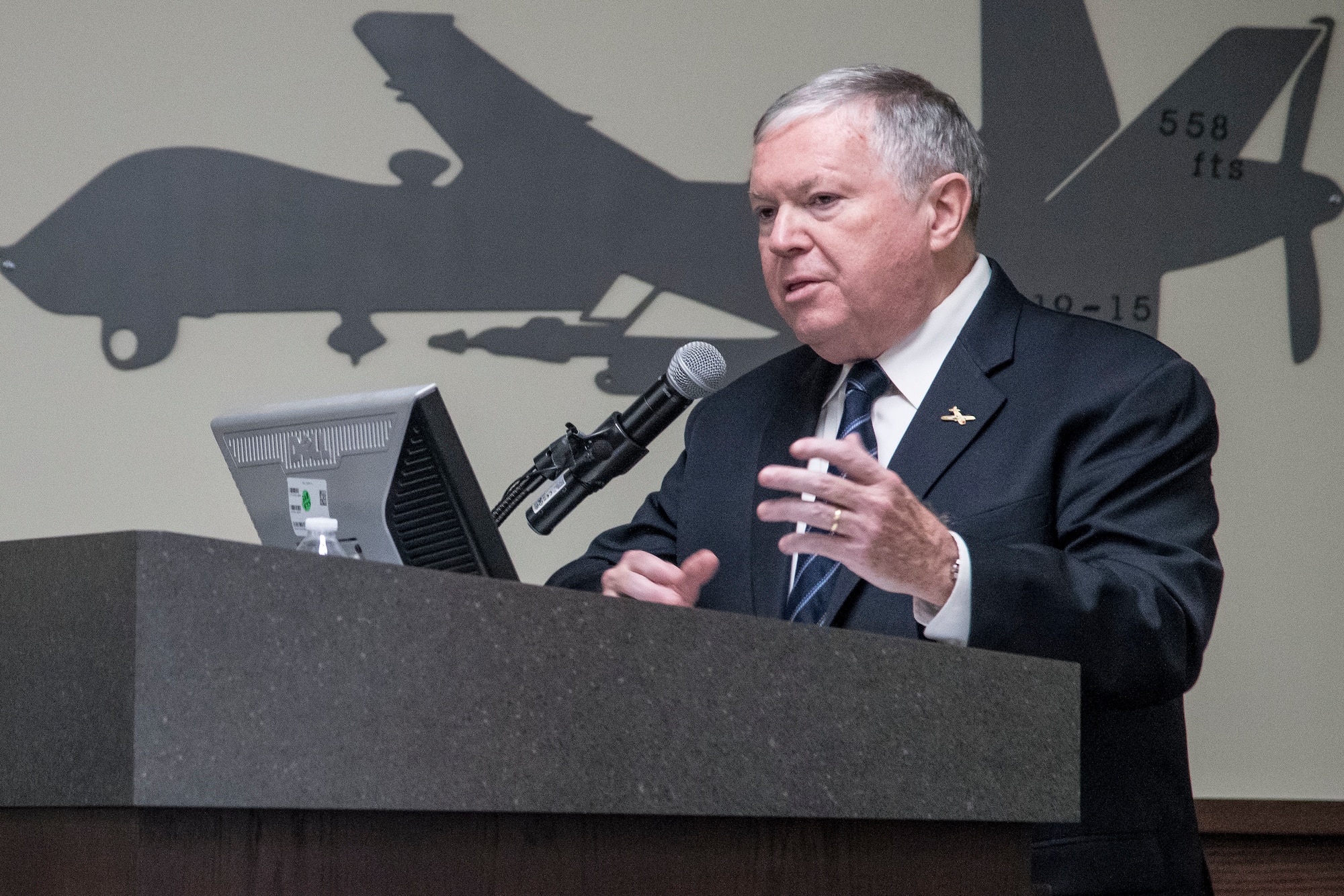 James Clark, family friend of the Crawford family, speaks during the 558th Flying Training Squadron’s Oliver “Ollie” Crawford Hall building dedication ceremony Nov. 13, 2019, at Joint Base San Antonio-Randolph, Texas. Crawford was a pilot, charter member of the Air Force Association and was instrumental in the formation of the Air Force Memorial in Washington, D.C. Crawford Hall is home to the 558th FTS, which is the sole source for all U.S. Air Force and U.S. Marine Corps undergraduate remotely piloted aircraft pilot and sensor operator training. (U.S. Air Force photo by Sean M. Worrell)