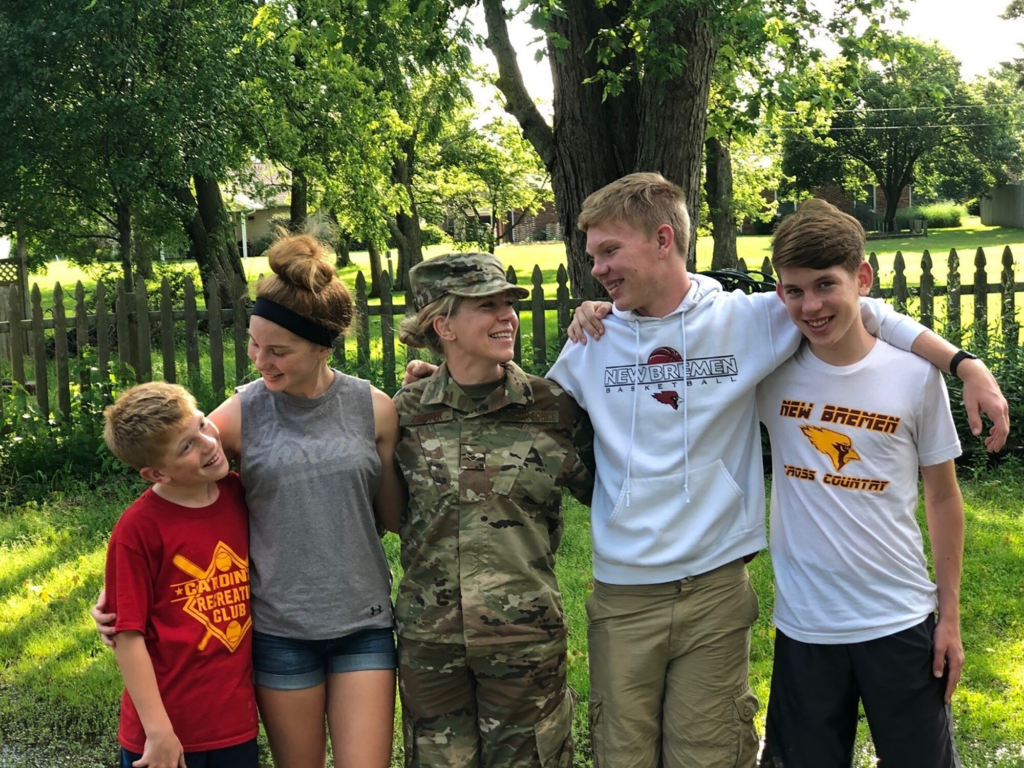 Airman 1st Class Erin Zimpfer, 445th Airlift Wing Public Affairs photojournalist, spends time with her children. Zimpfer started a new chapter in her life for herself and her children when she joined the Air Force right before the cut-off age of 39. (Courtesy photo)