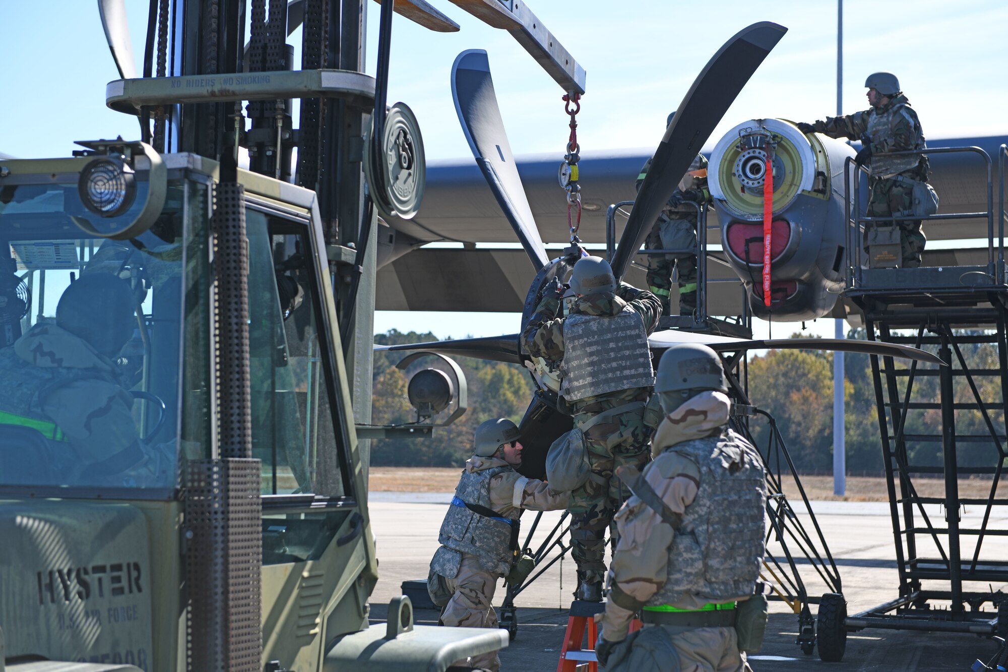 Airmen put gas in a C-130J