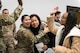 Airman 1st Class Kuyeon Bates (right), 2nd Force Support Squadron unit deployment manager, embraces Senior Airman Mia Luciano (left), 2nd FSS UDM, after returning from a short-term deployment to RAF Fairford, England, Nov. 14, 2019, at Barksdale Air Force Base, La. Over 300 Airmen and four B-52H Stratofortress aircraft were deployed in support of U.S. Strategic Command's Bomber Task Force. (U.S. Air Force photo by Airman 1st Class Lillian Miller)