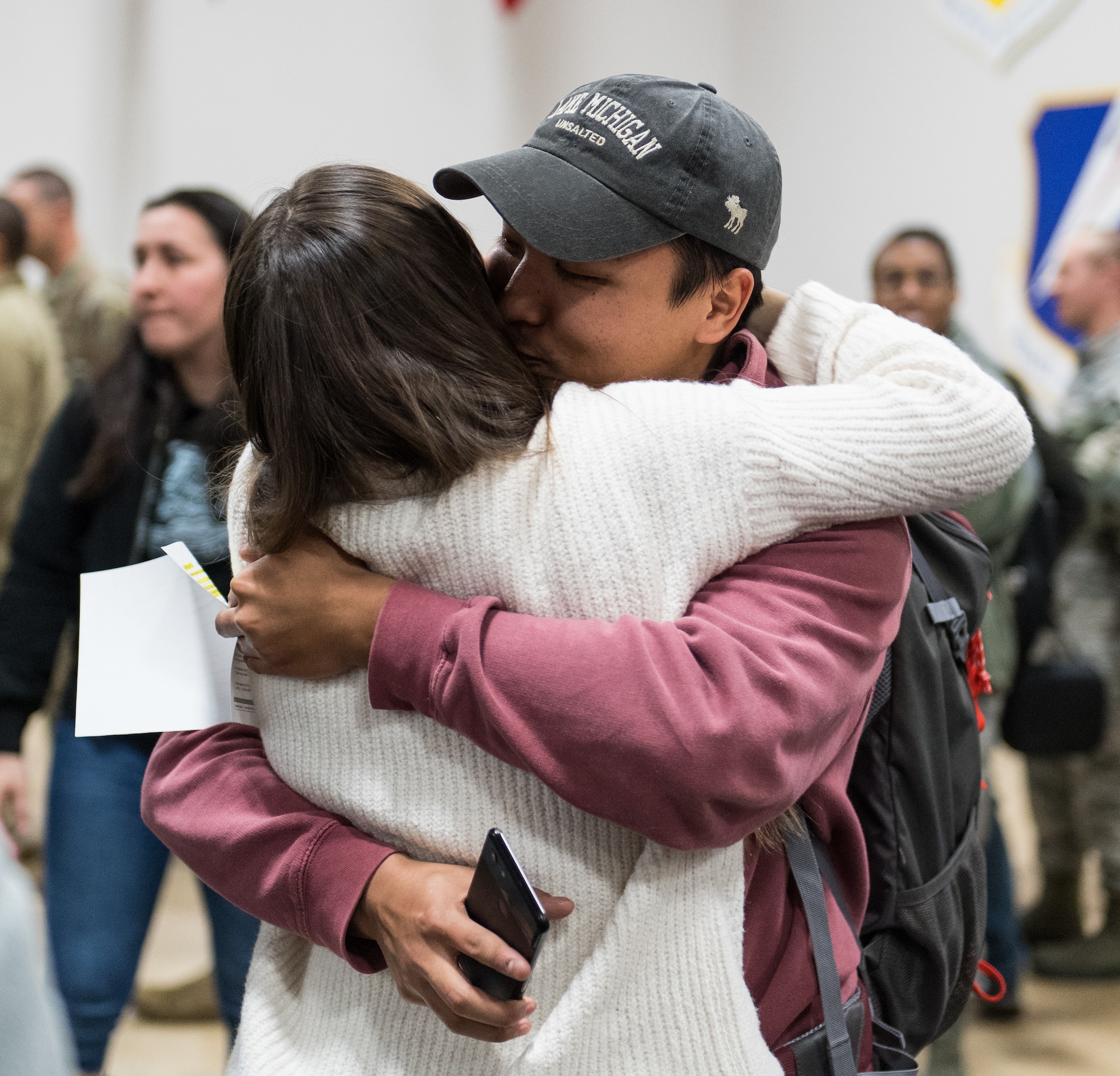 An Airman assigned to the 2nd Bomb Wing reunites with a loved one after returning from a short-term deployment to RAF Fairford, England, Nov. 14, 2019, at Barksdale Air Force Base, La. Over 300 Airmen and four B-52H Stratofortress aircraft were deployed in support of U.S. Strategic Command's Bomber Task Force. (U.S. Air Force photo by Airman 1st Class Lillian Miller)