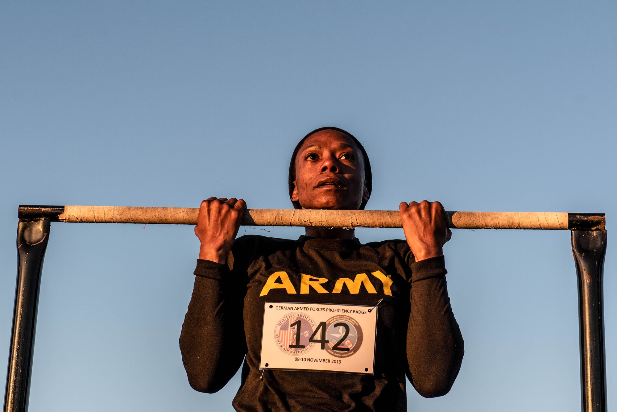 A U.S. Soldier grips a pull-up bar during the flexed arm hang portion of a German Armed Forces Proficiency Badge competition at McCrady Training Center in Eastover, South Carolina, Nov. 9, 2019.