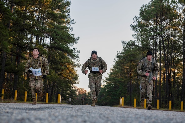 German Armed Forces Proficiency Badge competitors sprint during the ruck portion of the test at McCrady Training Center in Eastover, South Carolina, Nov. 10, 2019.
