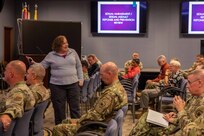 Carolyn Holmes, one of Joint Task Force Civil Support’s Sexual Harassment/Assault Response and Prevention (SHARP) victim advocates, delivers a brief during the command’s holiday safety stand down. The stand down also included a safety brief and a question and answer session with the commanding general. (Official DoD photo by Mass Communication Specialist 3rd Class Michael Redd/RELEASED)