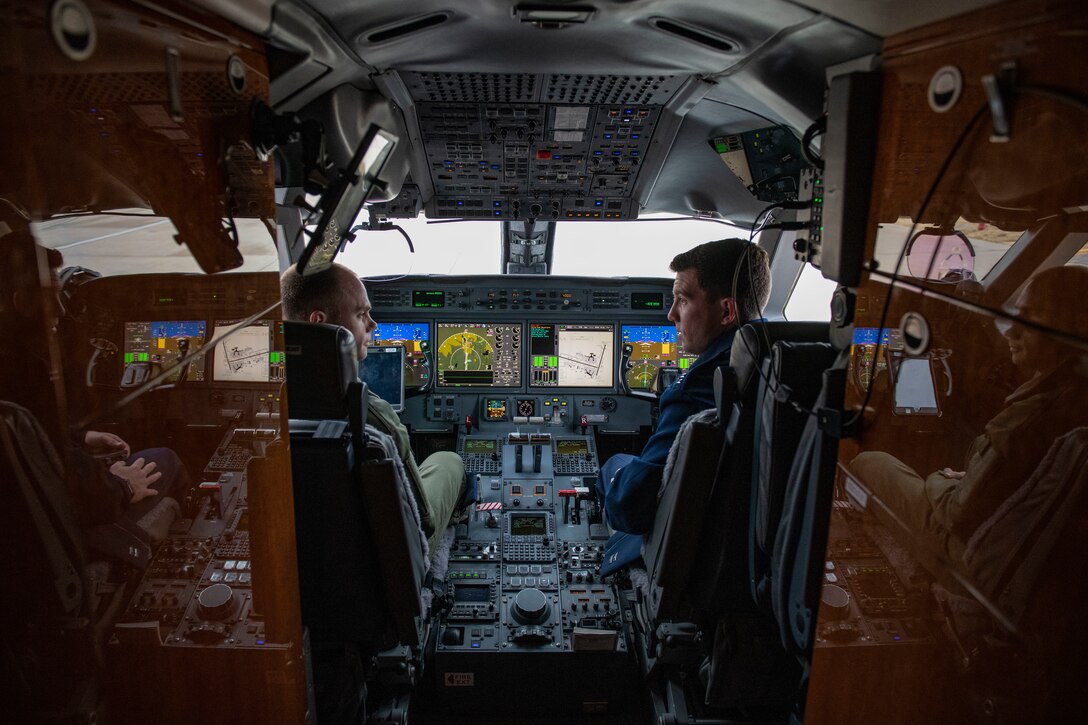 Pilots and flight attendants visit the 97th AMW.