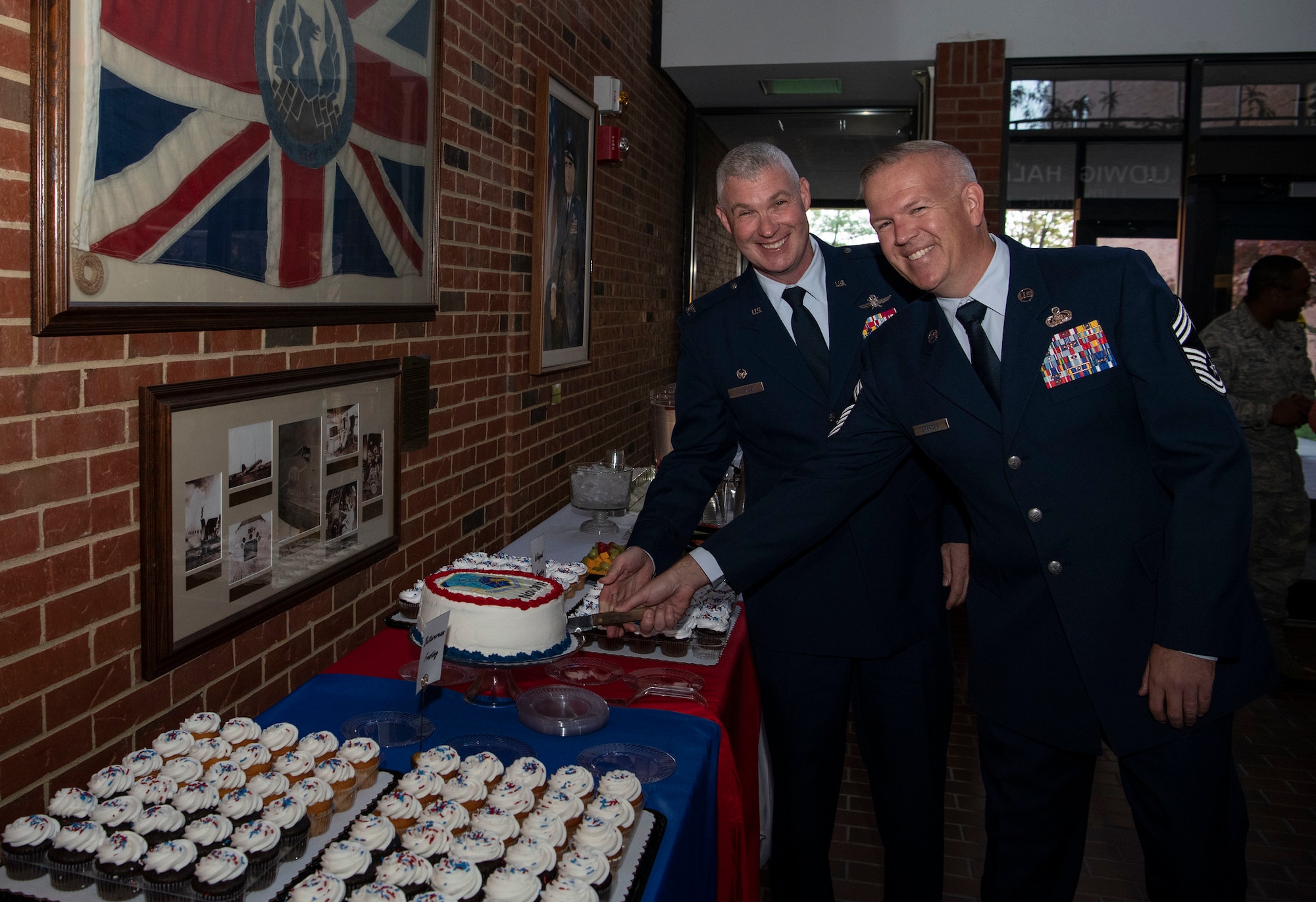 CC and CEM cut cake following Re-designation Ceremony 7 Nov 2019
