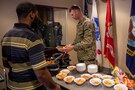 U.S. Marine Corps Staff Sargent Jordan Freking, a member of Joint Task Force Civil Support’s Morale, Welfare and Recreation committee, serves nachos during a MWR event at the command. The nacho sale was one of many held throughout the year to promote positive morale and well-being of personnel at the command. (Official DoD photo by Mass Communication Specialist 3rd Class Michael Redd/RELEASED)