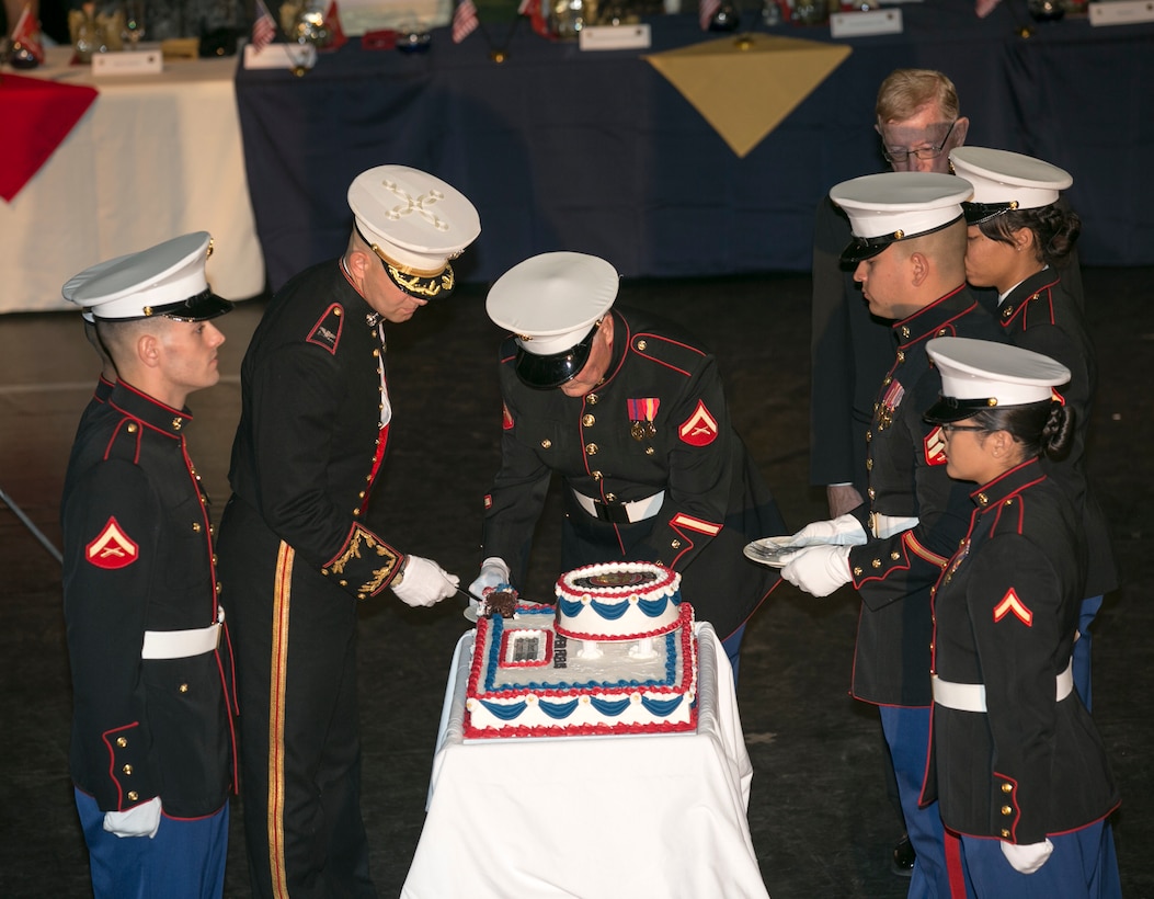 Col. Craig C. Clemans, commanding office of marine Corps Logistics Base Barstow, assisted by Tim Hille, commander of the High Desert Marines performs the traditional cake-cutting ceremony during MCLB Barstow/High Desert Marines 244th Birthday Ball Nov. 2.