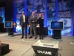 Jeff Hough (center), senior scientist and technical manager and the Navy’s distinguished engineer for ship design at Naval Surface Warfare Center Carderock Division, receives the SNAME 2019 David W. Taylor Medal during the SNAME Convention in Tacoma, Washington, on Oct. 31. (Photo provided)