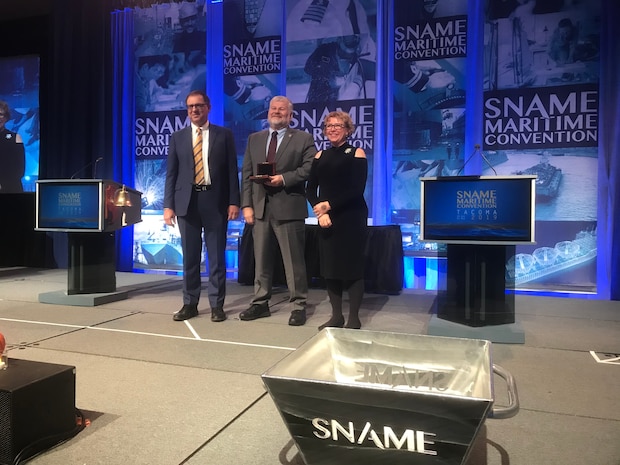 Jeff Hough (center), senior scientist and technical manager and the Navy’s distinguished engineer for ship design at Naval Surface Warfare Center Carderock Division, receives the SNAME 2019 David W. Taylor Medal during the SNAME Convention in Tacoma, Washington, on Oct. 31. (Photo provided)